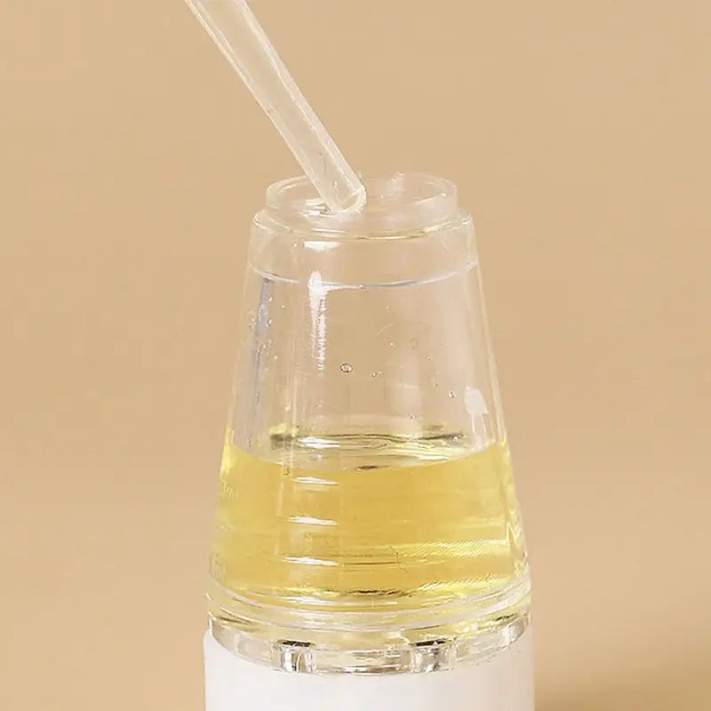 Applicatore per olio per capelli